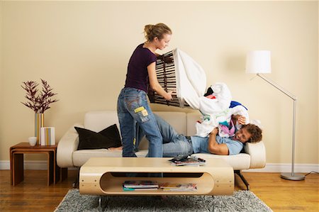 Woman Dumping Laundry on Man Stock Photo - Rights-Managed, Code: 700-00683249