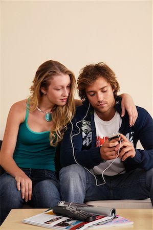 simsearch:700-00683268,k - Couple Listening to MP3 Player Stock Photo - Rights-Managed, Code: 700-00683262