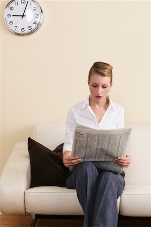 Businesswoman Reading Financial Page Stock Photo - Rights-Managed, Code: 700-00683298