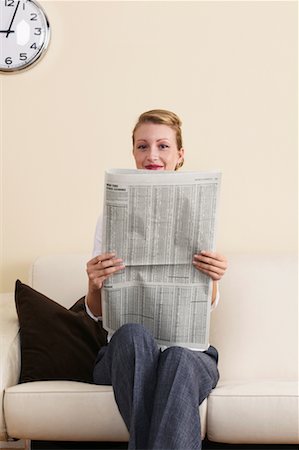 Businesswoman Reading Financial Page Stock Photo - Rights-Managed, Code: 700-00683299