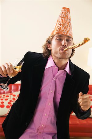 pictures of man at new years eve party - Man at New Year's Eve Party Stock Photo - Rights-Managed, Code: 700-00683304