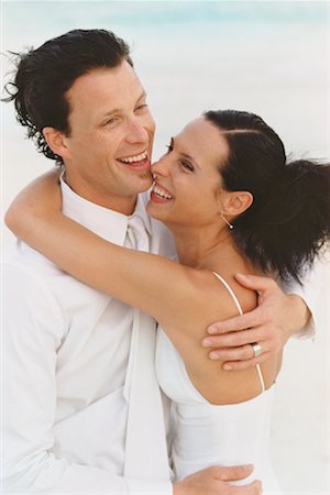 Bride and Groom Hugging on Beach Stock Photo - Rights-Managed, Code: 700-00695674