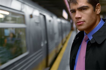 Homme d'affaires en attente de métro Photographie de stock - Rights-Managed, Code: 700-00695767