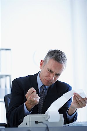 Man Upset at Adding Machine Print-Out Stock Photo - Rights-Managed, Code: 700-00695814
