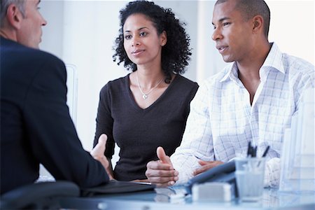 serious counselor talking with person - Couple Speaking with Financial Advisor Stock Photo - Rights-Managed, Code: 700-00695815