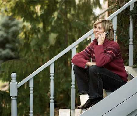 device front porch - Woman Using Cellular Phone Stock Photo - Rights-Managed, Code: 700-00695884