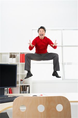 simsearch:700-03891174,k - Businessman Jumping in Air Foto de stock - Con derechos protegidos, Código: 700-00711457