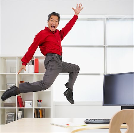 funny office chairs pictures - Businessman Jumping in the Air Stock Photo - Rights-Managed, Code: 700-00711451