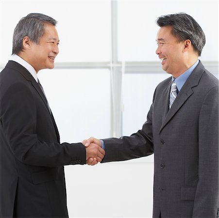 simsearch:600-07311112,k - Businessmen Shaking Hands Stock Photo - Rights-Managed, Code: 700-00711473