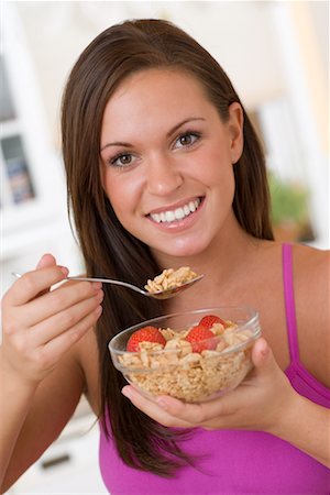 Woman Eating Cereal Stock Photo - Rights-Managed, Code: 700-00711597