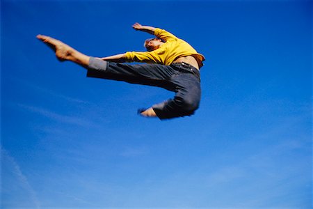 simsearch:640-03255435,k - Man Jumping Stock Photo - Rights-Managed, Code: 700-00711738