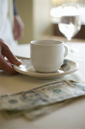 Waiter Picking up Coffee Mug Stock Photo - Rights-Managed, Code: 700-00711781