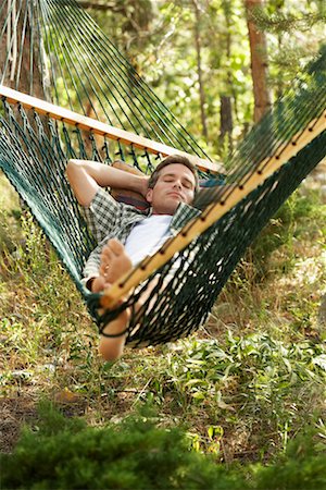 pictures of men sleeping in hammocks - Man Lying in Hammock Stock Photo - Rights-Managed, Code: 700-00747971