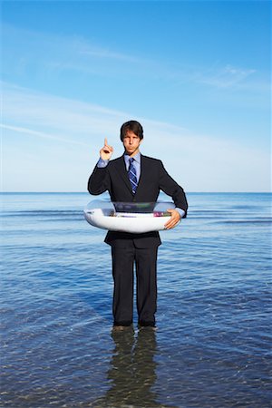 Businessman Wearing Floatation Device Stock Photo - Rights-Managed, Code: 700-00748151