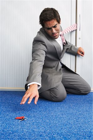 Businessman with Necktie Caught in Door Foto de stock - Con derechos protegidos, Código: 700-00748515