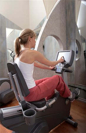 simsearch:700-00767943,k - Woman Using Exercise Bike Stock Photo - Rights-Managed, Code: 700-00767933