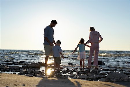 Family on Rocky Shoreline Stock Photo - Rights-Managed, Code: 700-00768222