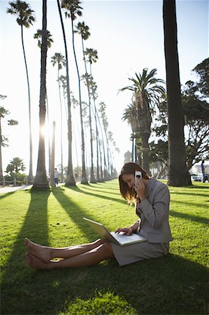 Businesswoman Sitting Outdoors With Laptop and Cell Phone Stock Photo - Rights-Managed, Code: 700-00768341