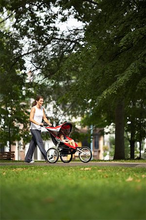 Woman Pushing Baby in Stroller Stock Photo - Rights-Managed, Code: 700-00768353