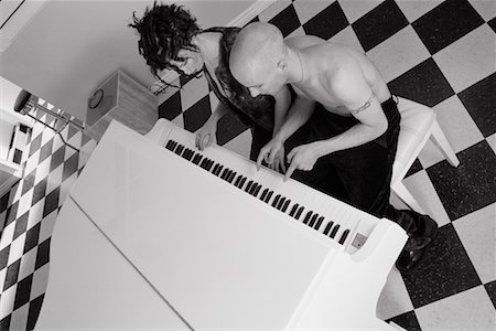 simsearch:695-05778554,k - Couple Playing Piano Fotografie stock - Rights-Managed, Codice: 700-00768423