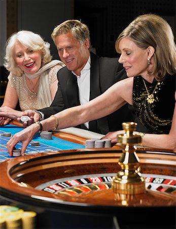 people sitting in casino - People Playing Roulette Stock Photo - Rights-Managed, Code: 700-00768655