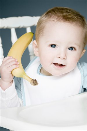 Baby Playing with Banana Foto de stock - Direito Controlado, Número: 700-00768884