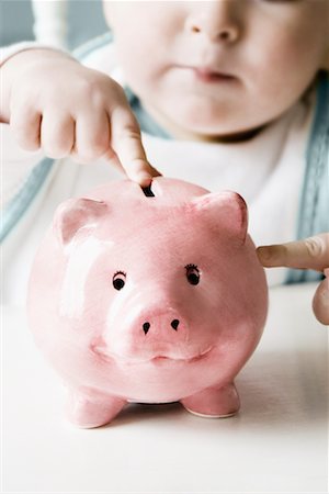 Baby Pointing at Piggy Bank Fotografie stock - Rights-Managed, Codice: 700-00768883