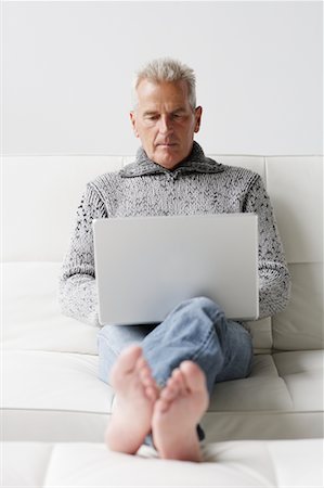 senior man feet up - Man Working on Laptop Stock Photo - Rights-Managed, Code: 700-00782353