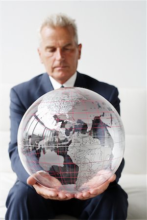 ron fehling globe - Mature Man Holding Globe Stock Photo - Rights-Managed, Code: 700-00782379