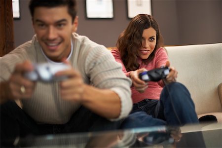 Couple Playing Video Games Fotografie stock - Rights-Managed, Codice: 700-00782619