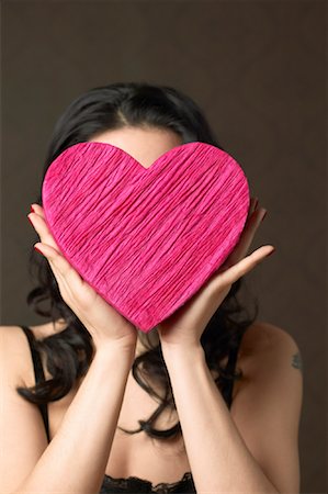 simsearch:700-00795359,k - Woman Holding Heart Shaped Box Fotografie stock - Rights-Managed, Codice: 700-00795343