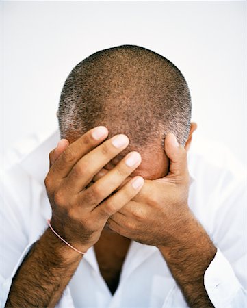 Portrait of Man with Head in Hands Stock Photo - Rights-Managed, Code: 700-00795398