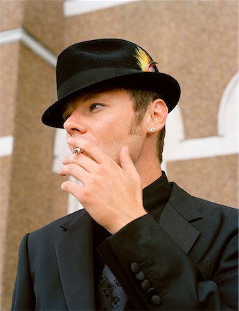 face close up young man looking sideways - Portrait of Man Smoking Stock Photo - Rights-Managed, Code: 700-00795829