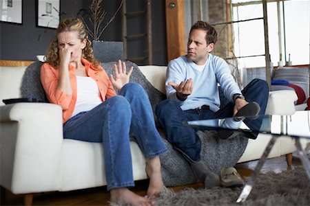 plugging nose - Woman Offended by Man's Foot Odor Stock Photo - Rights-Managed, Code: 700-00795886