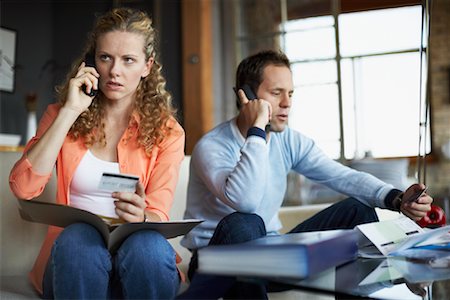 Couple Working on Finances Foto de stock - Con derechos protegidos, Código: 700-00795888