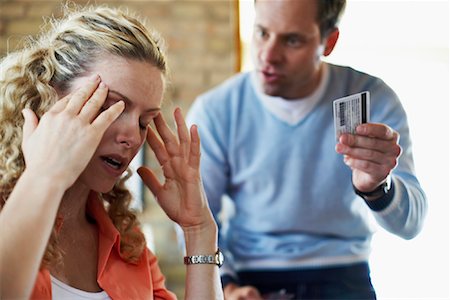 Couple Fighting over Credit Card Bill Stock Photo - Rights-Managed, Code: 700-00795891