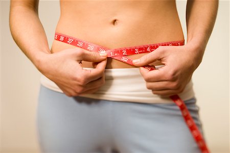 Woman Measuring Waist Stock Photo - Rights-Managed, Code: 700-00796164