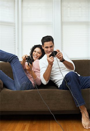 Boyfriend and girlfriend playing video games together Stock Photos - Page 1  : Masterfile