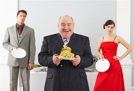 fat bald men suits - Man Taking All the Food At a Wedding Reception Stock Photo - Rights-Managed, Code: 700-00796299