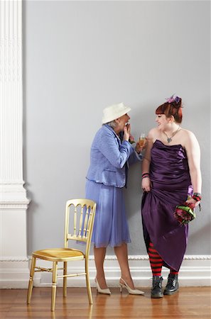 fancy dress party mature women - Bridesmaid Showing Striped Stockings to Wedding Guest Stock Photo - Rights-Managed, Code: 700-00796328