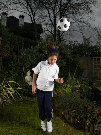 Girl Playing with Soccer Ball Stock Photo - Rights-Managed, Code: 700-00796709