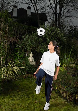 Girl Playing with Soccer Ball Stock Photo - Rights-Managed, Code: 700-00796711