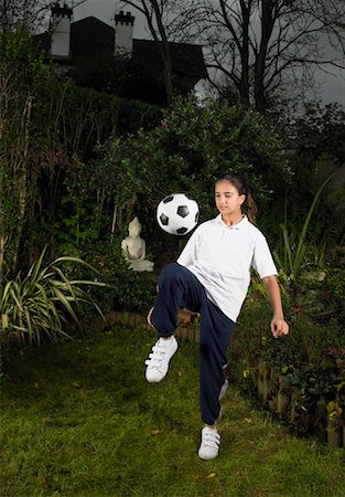 Girl Playing with Soccer Ball Stock Photo - Rights-Managed, Code: 700-00796712