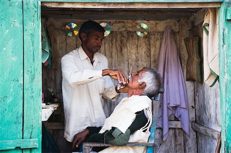 Man Getting a Shave and Haircut, Madhya Pradesh, India Stock Photo - Rights-Managed, Code: 700-00800861