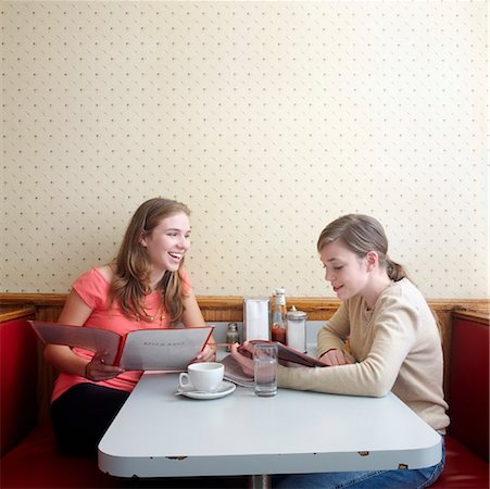 simsearch:700-00634096,k - Young Women in Diner Studying Menus Stock Photo - Rights-Managed, Code: 700-00819408