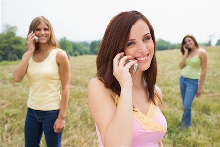 Women in Field With Cellular Telephones Stock Photo - Rights-Managed, Code: 700-00819633