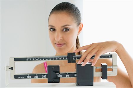 simsearch:700-01248936,k - Woman Standing on Scale Stock Photo - Rights-Managed, Code: 700-00823544
