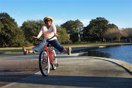 ridiculous fat person - Woman Riding A Bicycle Stock Photo - Rights-Managed, Code: 700-00846793