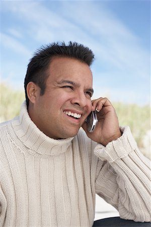 Man Using Cell Phone At The Beach Stock Photo - Rights-Managed, Code: 700-00847012
