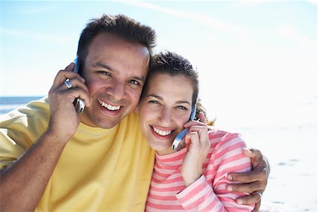 Couple Using Cell Phones At Beach Stock Photo - Rights-Managed, Code: 700-00847032
